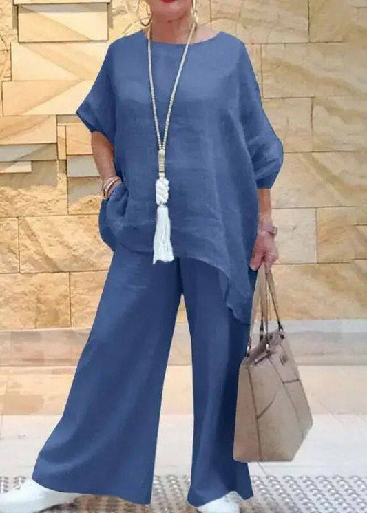 Conjunto de dos piezas de talla grande, camiseta azul de cuello redondo asimétrica y pantalón de pierna ancha de manga corta