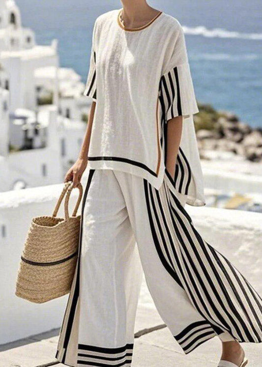 Conjunto de dos piezas de camiseta de rayas negras con abertura lateral y pantalón de pierna ancha de manga corta